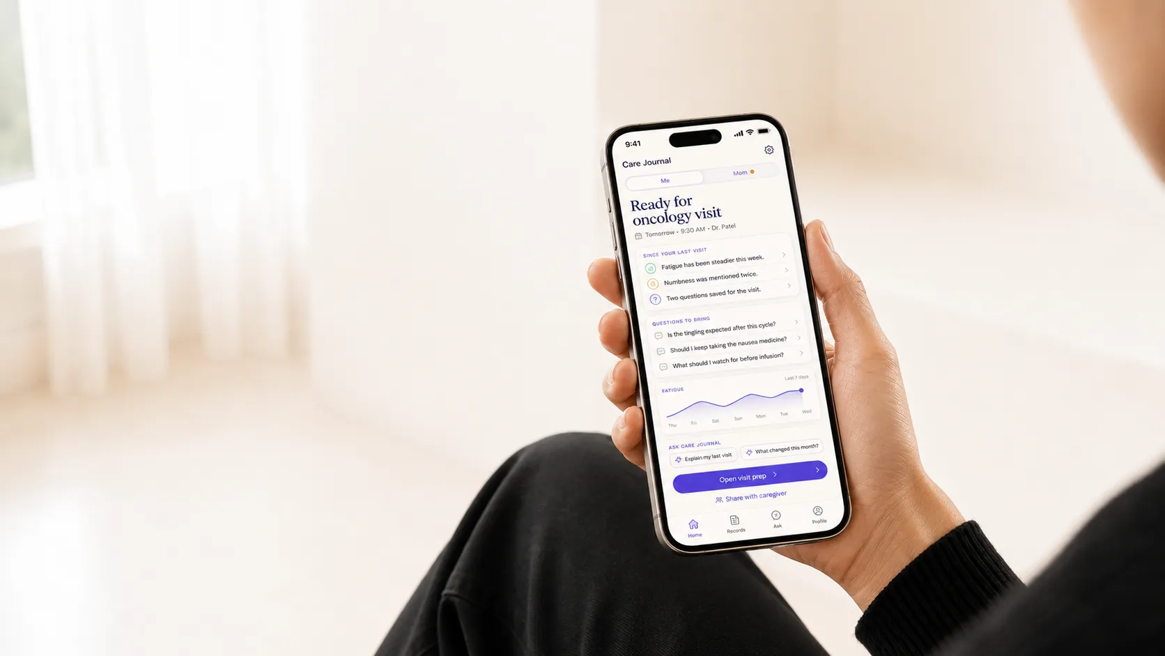 Editorial photo of a patient holding the ctcae grading mobile app.